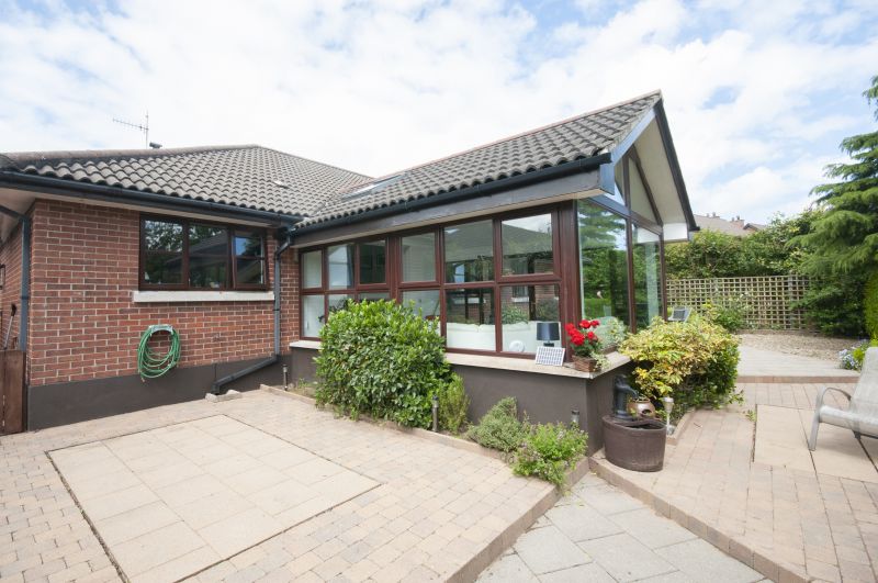 Traditional Sunroom with Brick Base